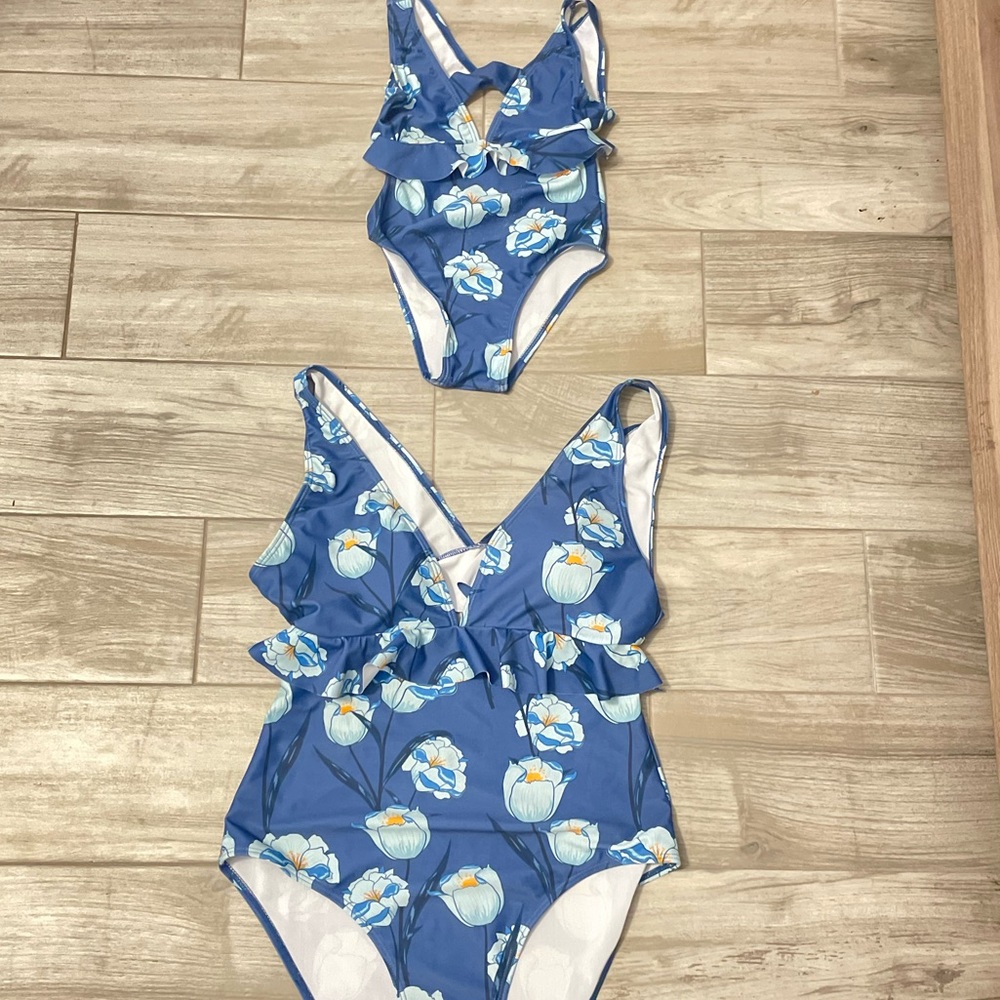 Matching swimsuits mom and daughter